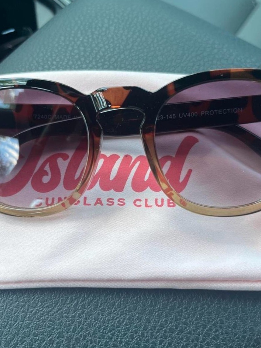 Tortoiseshell Round Sunglasses with Purple Lenses